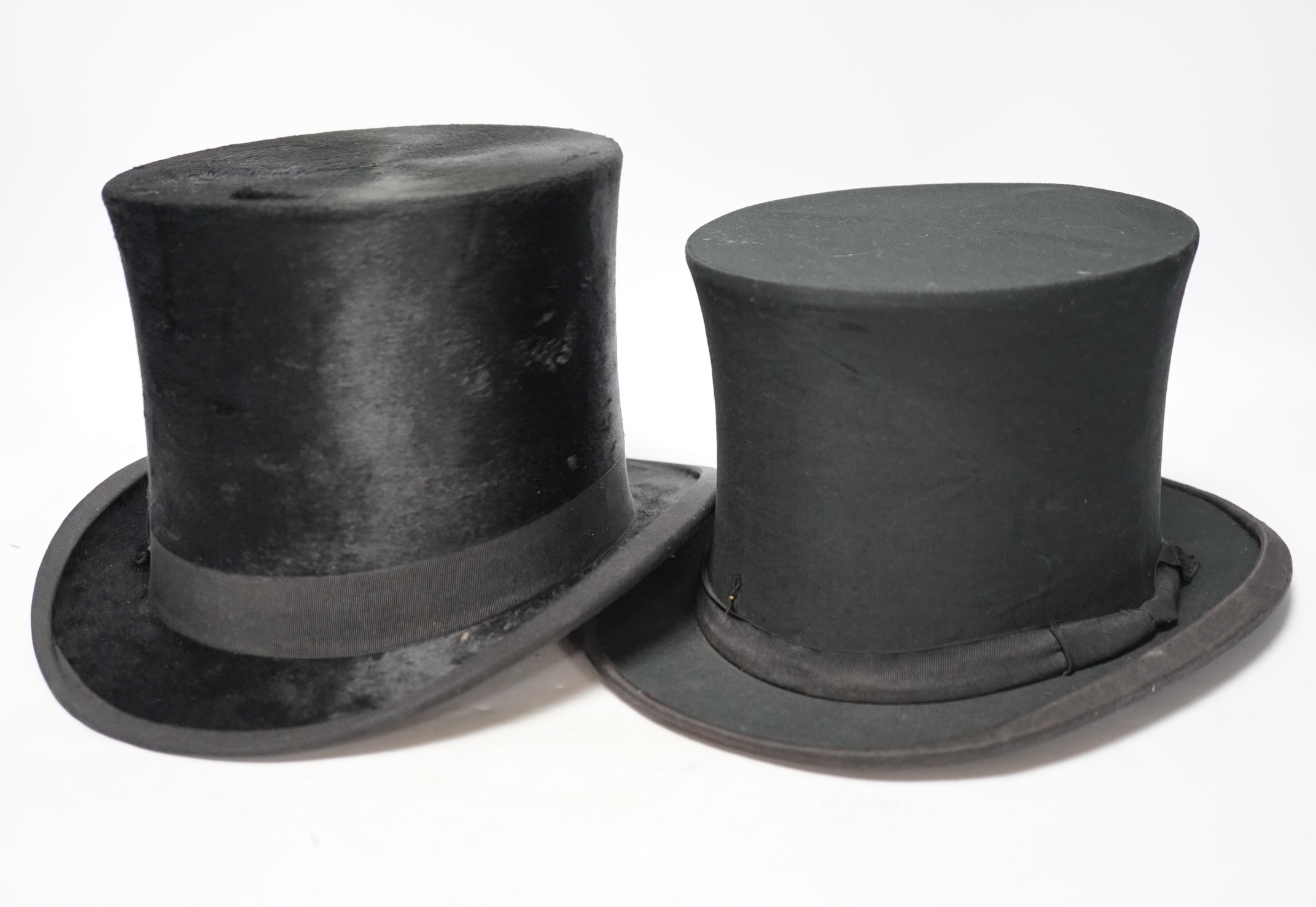 A brown leather top hat case together with a black silk collapsible top hat/opera hat and another, case 25cm high